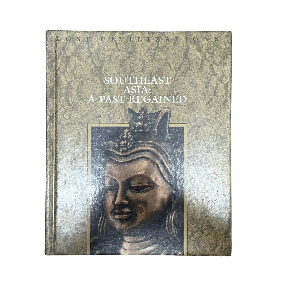 Book titled 'Southeast Asia: A Past Regained' with a decorative cover featuring an image of a statue.