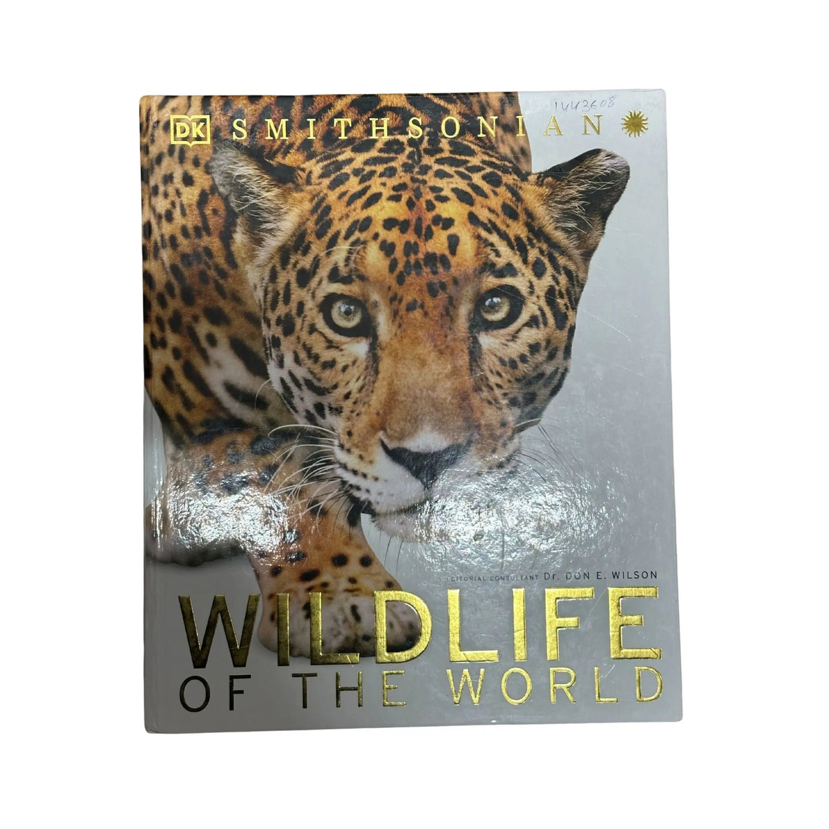 Book titled 'Wildlife of the World' with a leopard on the cover, published by DK Smithsonian.